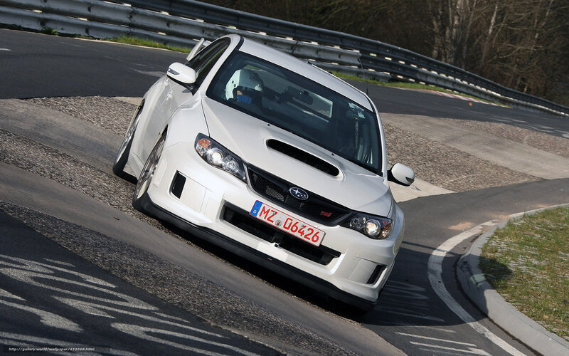 white subaru on racetrack