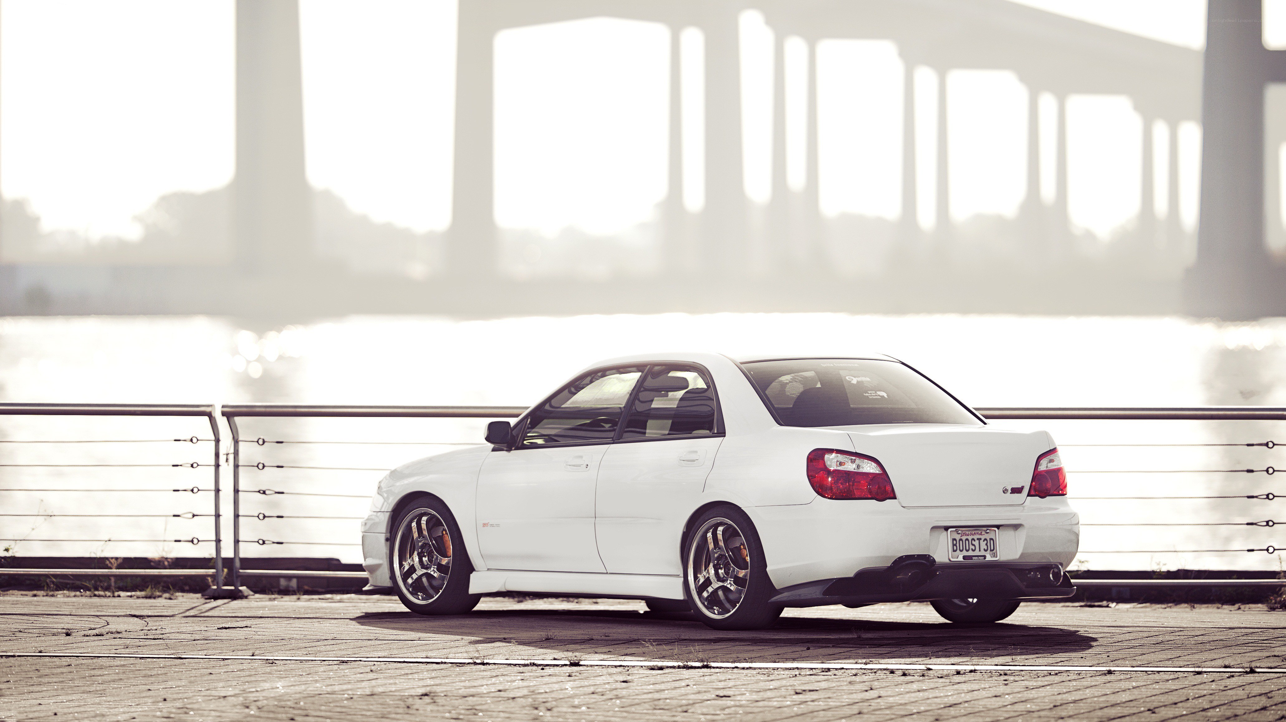 white subaru on waterfront
