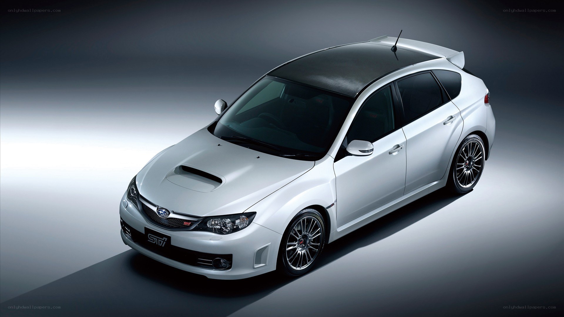 white subaru sti hatchback