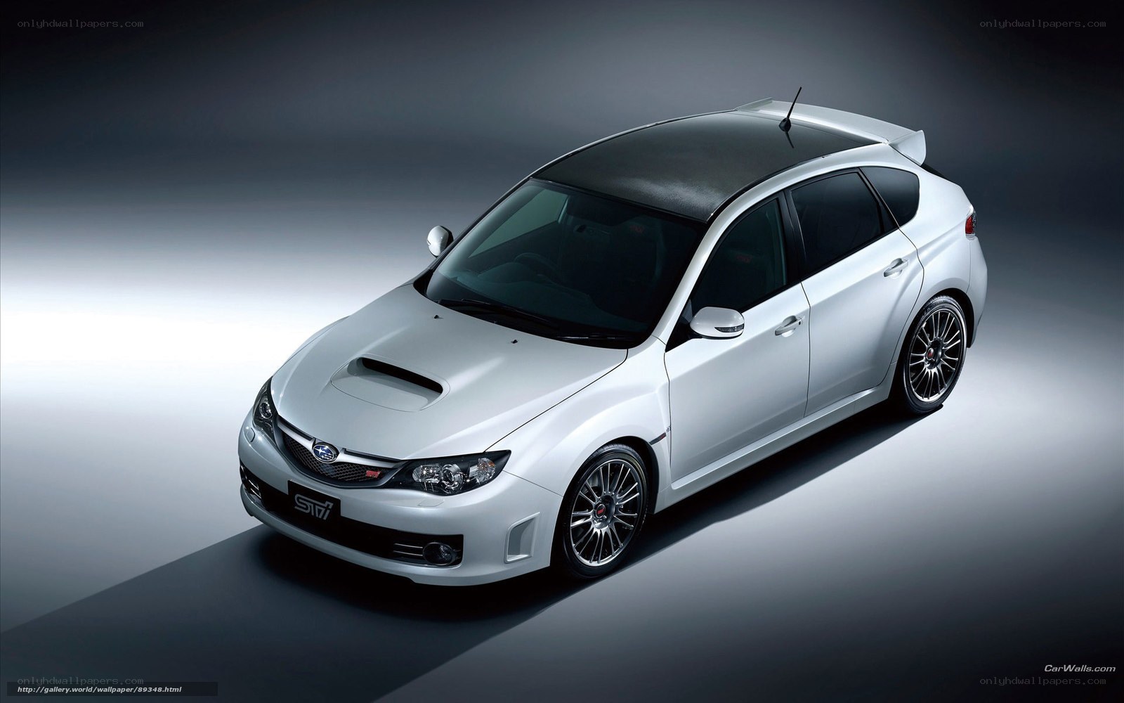 white subaru sti hatchback
