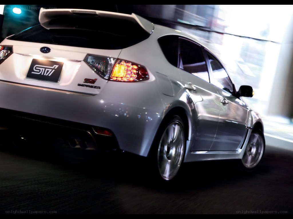 White Subaru STI in motion