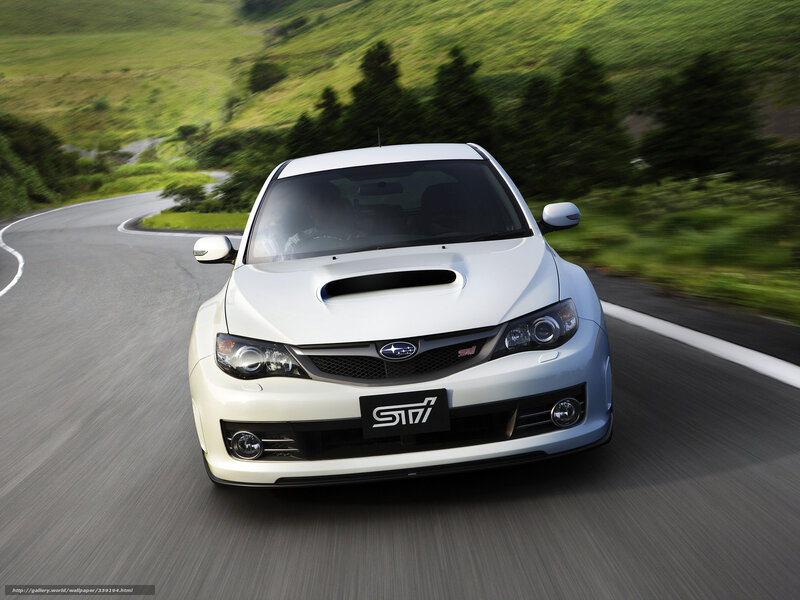 white subaru sti on winding road