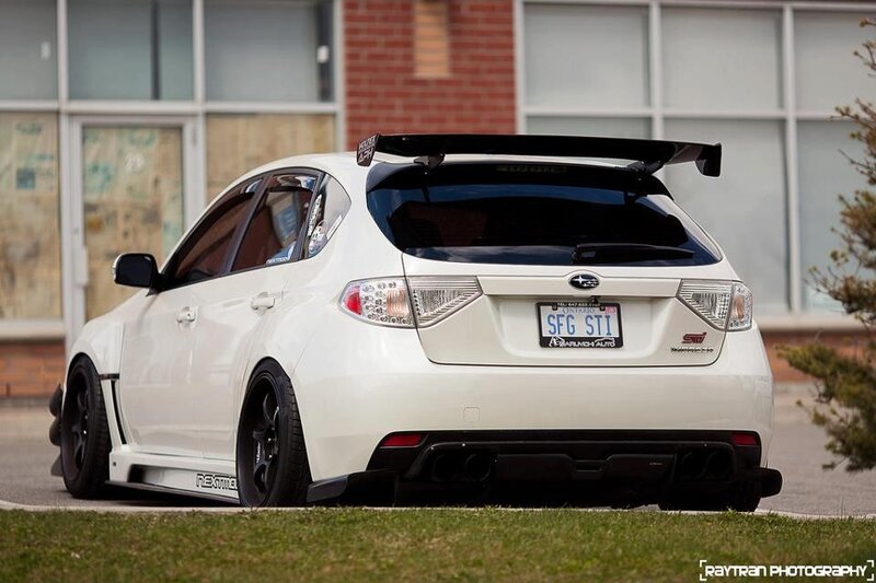 white subaru sti with rear spoiler