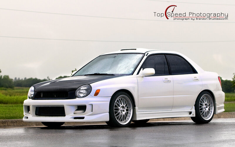 white subaru with black hood