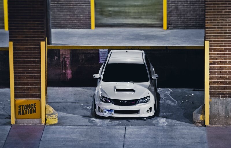 White Subaru Wrx Sti — Dramatic, Night, Photograph, Car, Parking Garage, Brick Wall