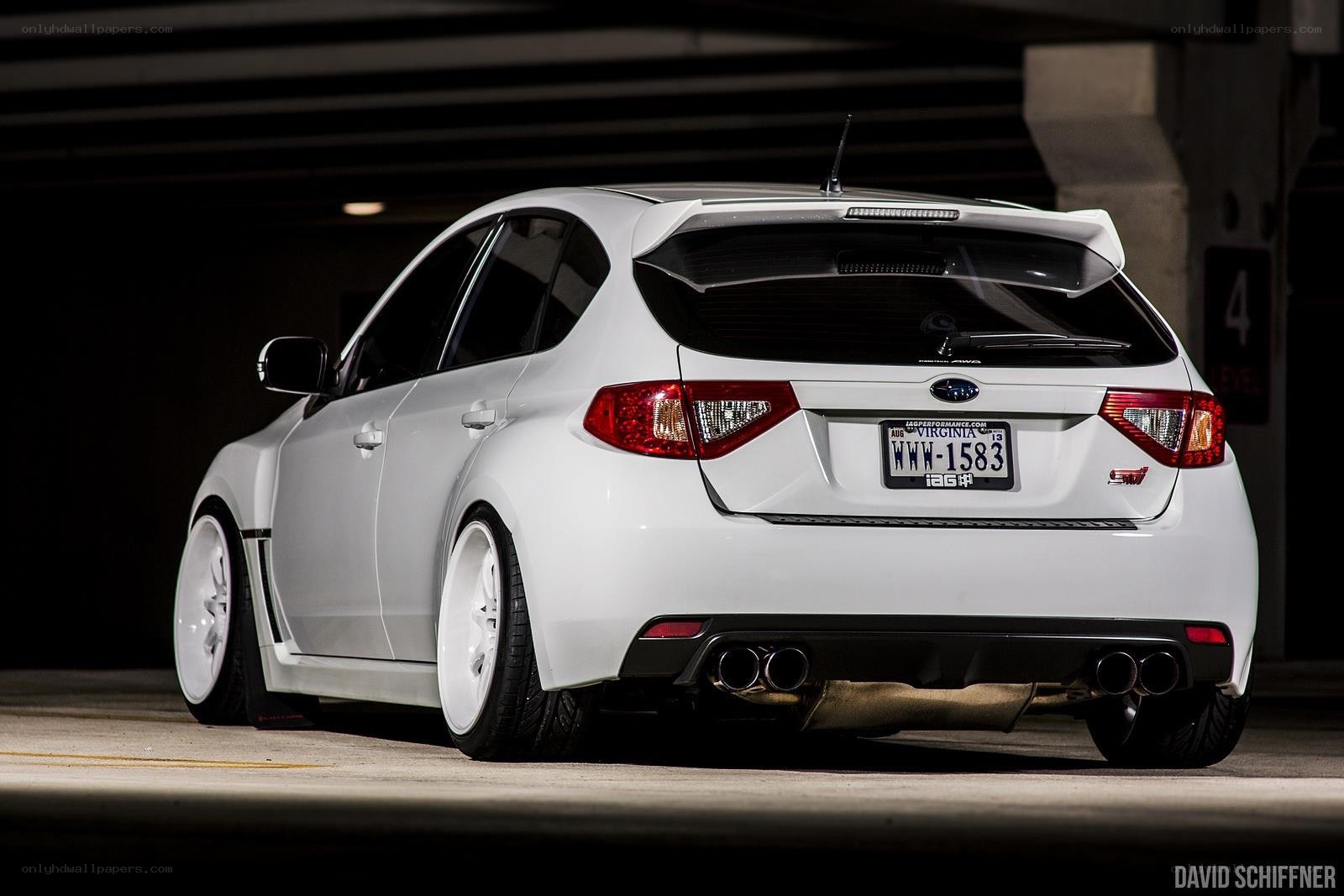 white subaru wrx sti hatchback