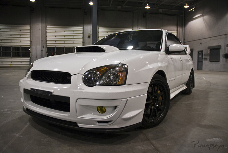 white subaru wrx sti in garage