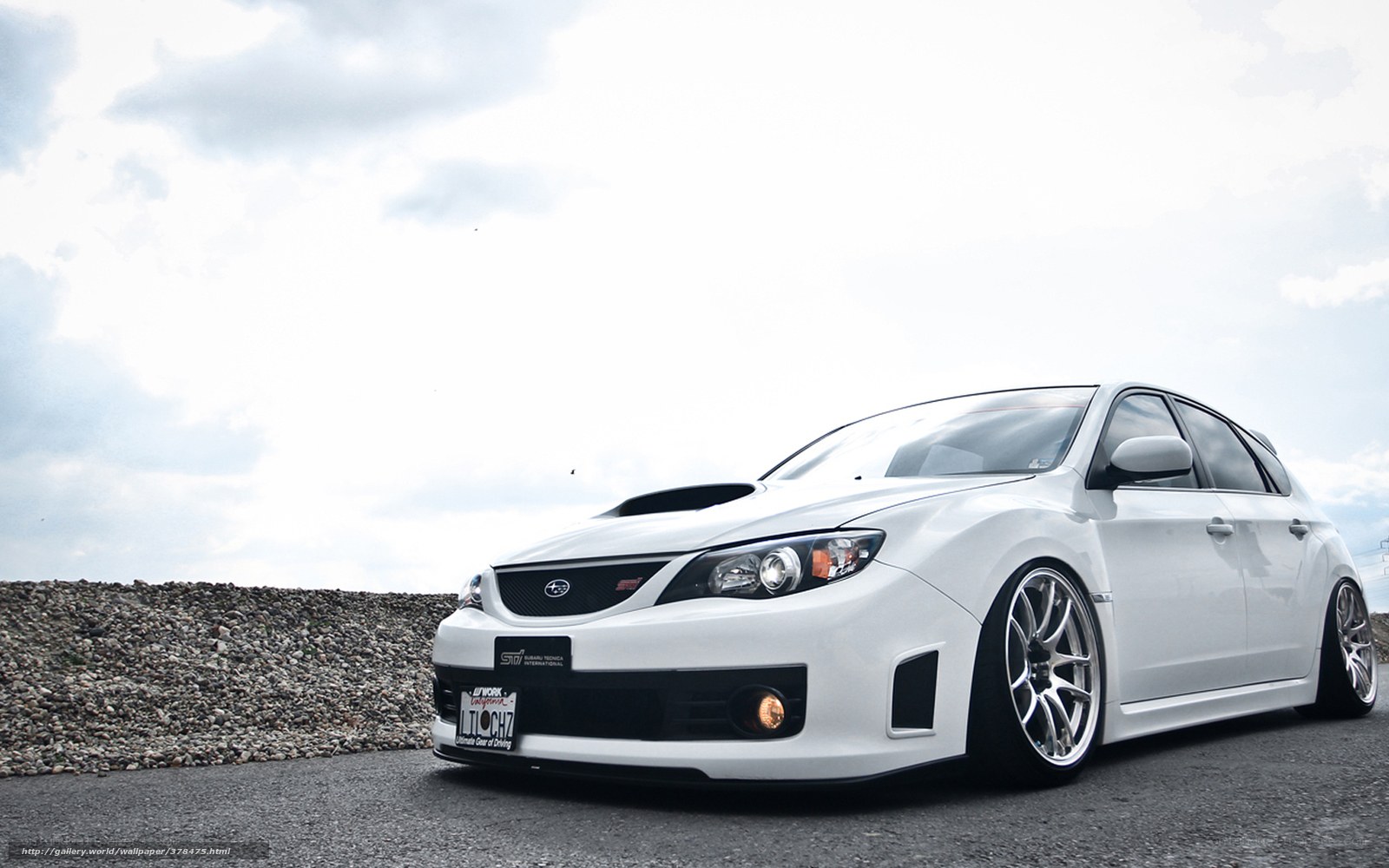 white subaru wrx sti on asphalt