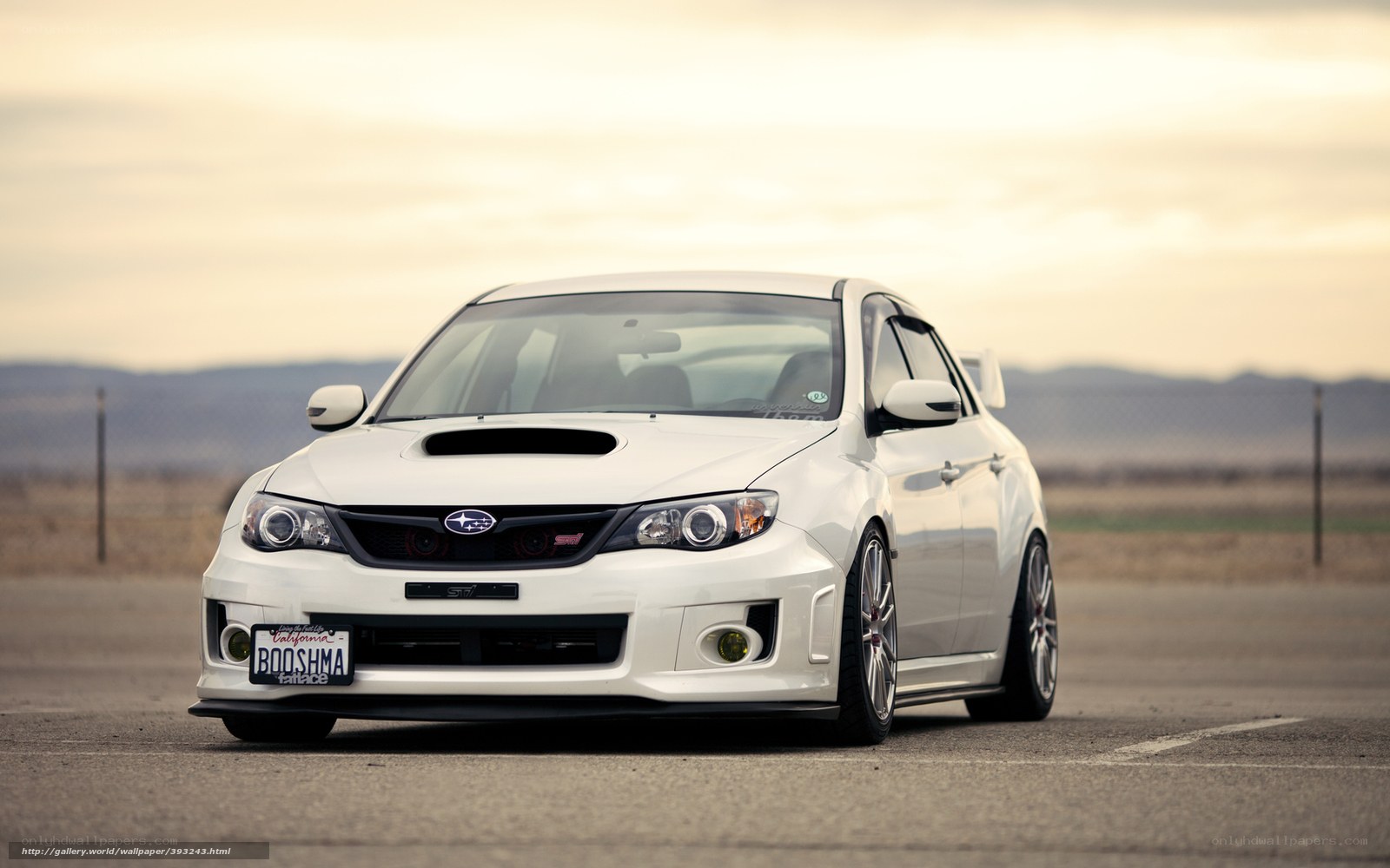 white subaru wrx sti on track