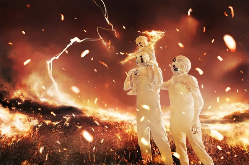 White-suited Figures in Fire