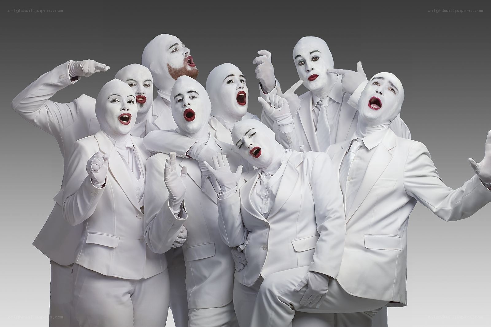 White-suited performers in a group