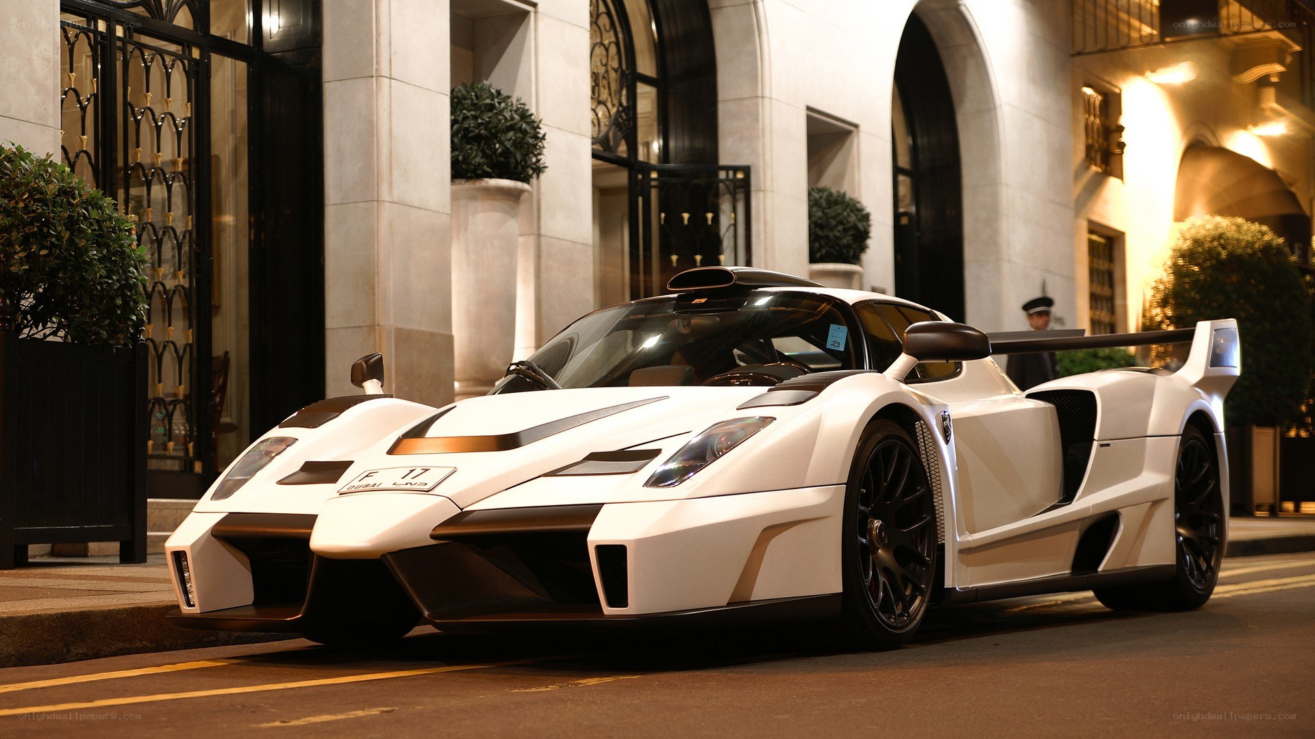 White supercar on city street