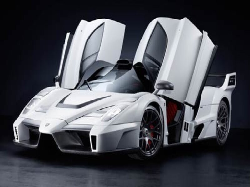 white supercar with doors open