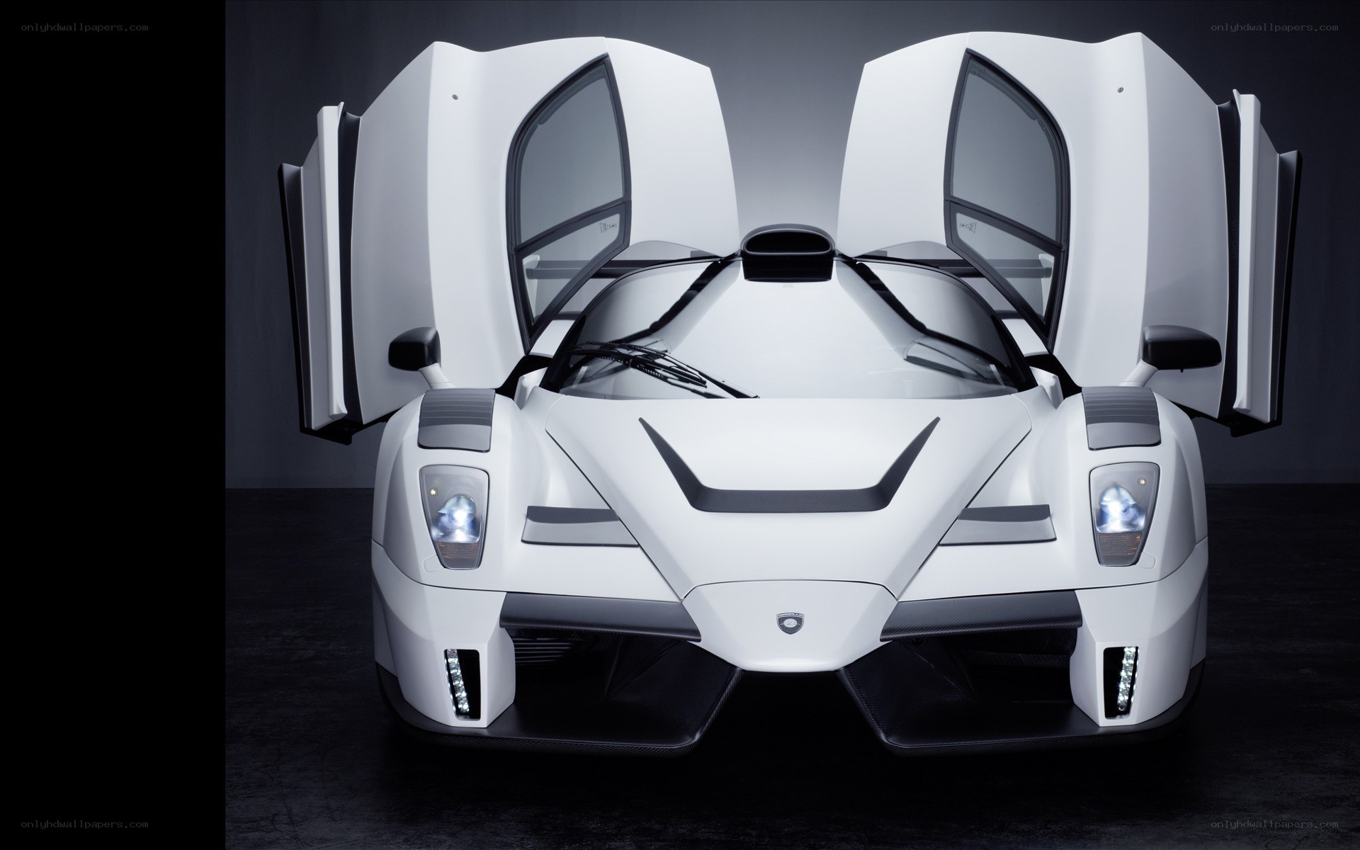 white supercar with doors open