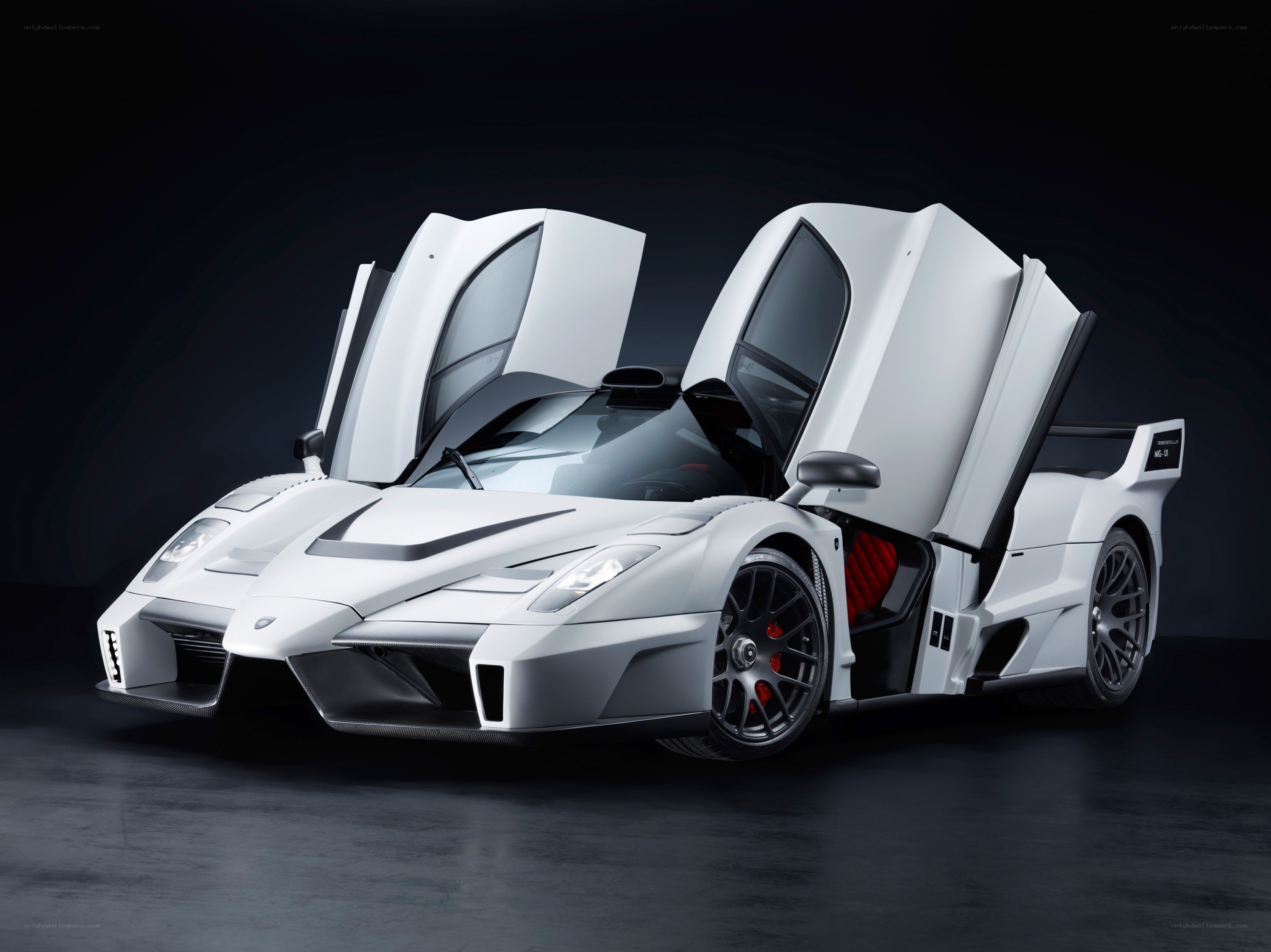 white supercar with doors open