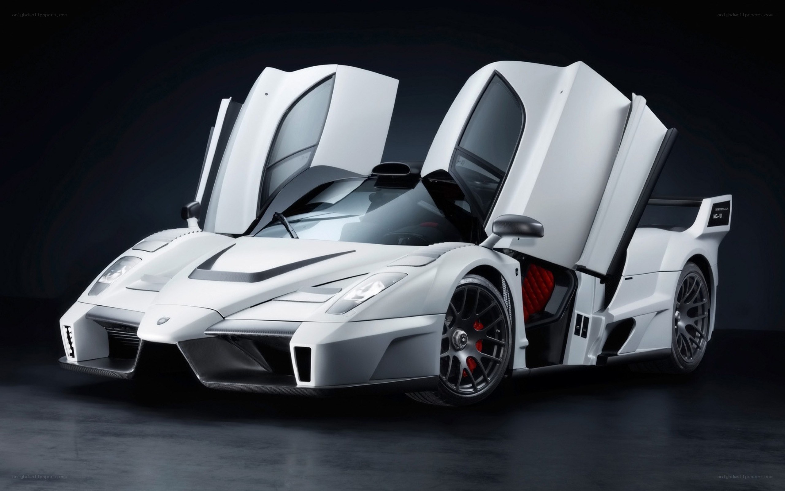 white supercar with doors open