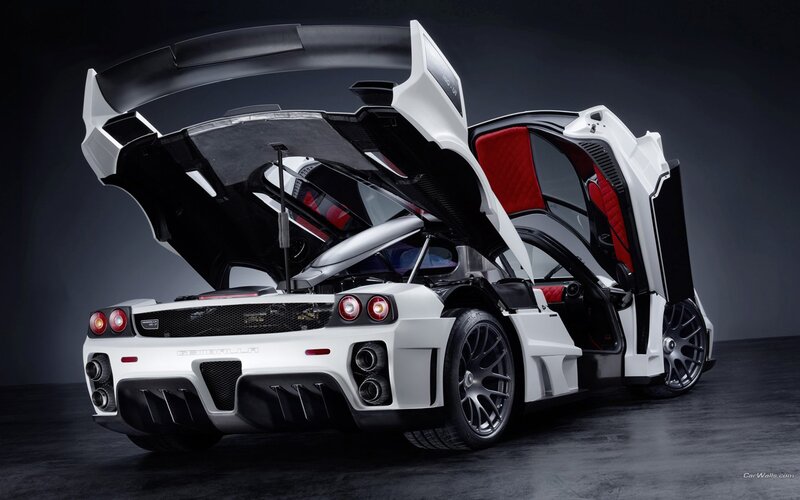 white supercar with open doors