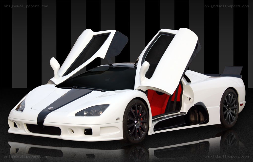 white supercar with open doors