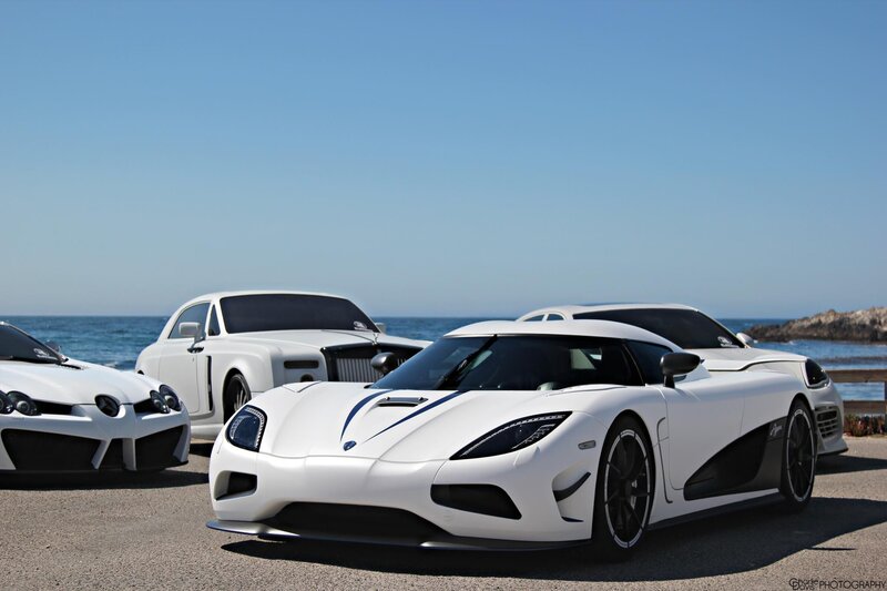White supercars by the ocean