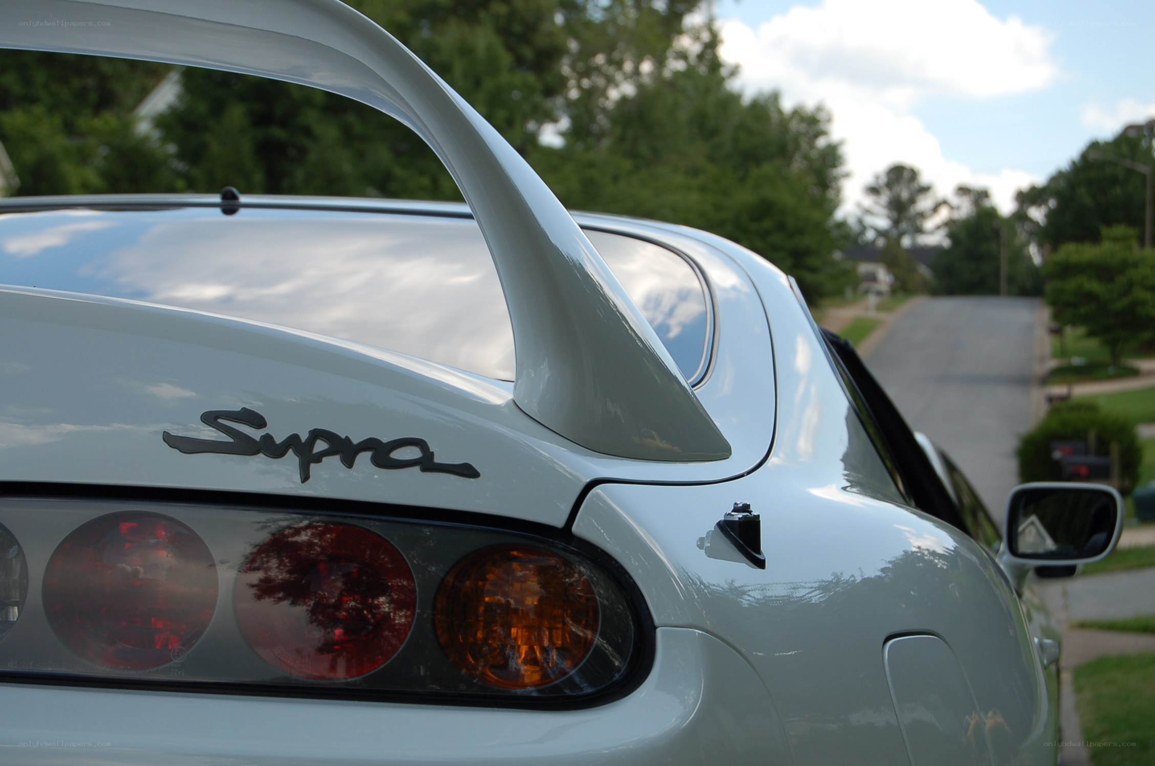 White Supra with rear spoiler