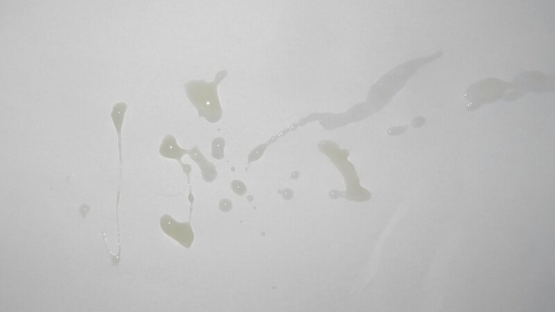 white surface with liquid splatters
