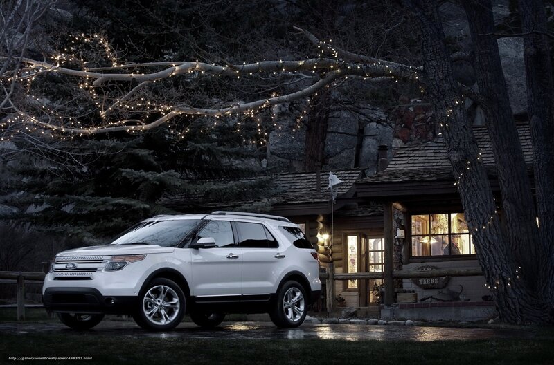 White SUV at a cabin
