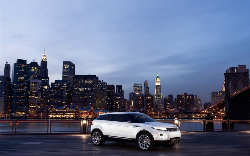 White SUV at dusk in city