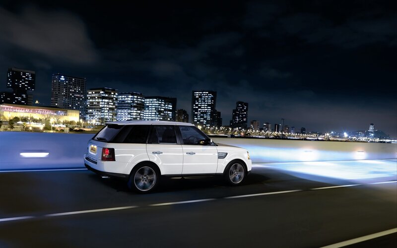 White SUV at night in city