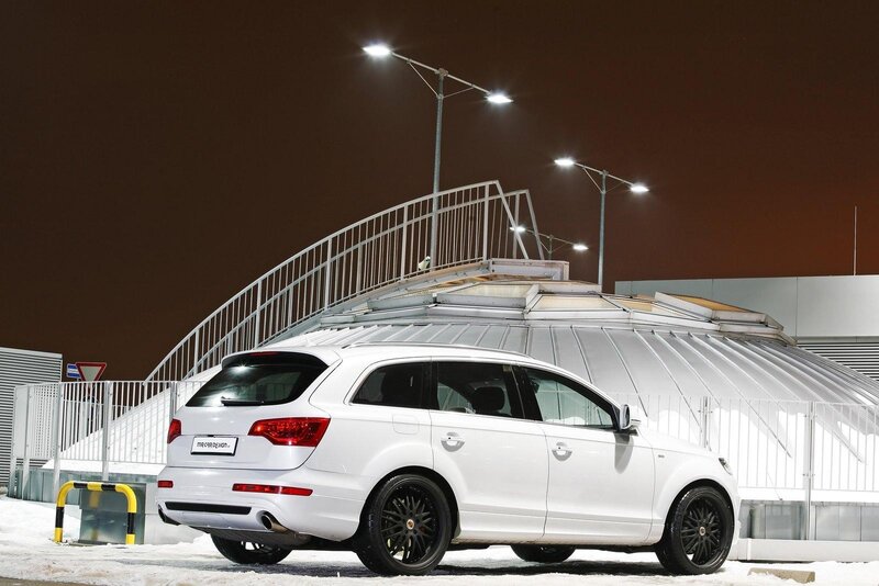 White SUV at night in snow