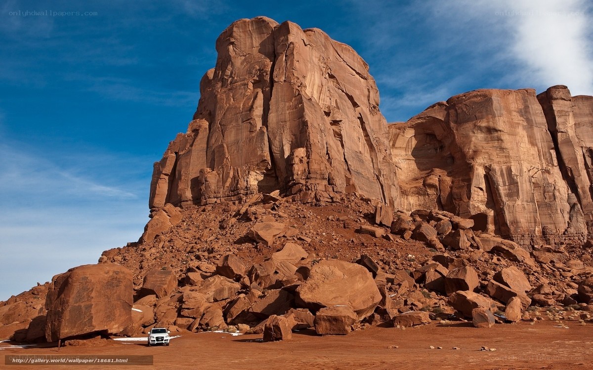 White SUV at Red Rock Formation