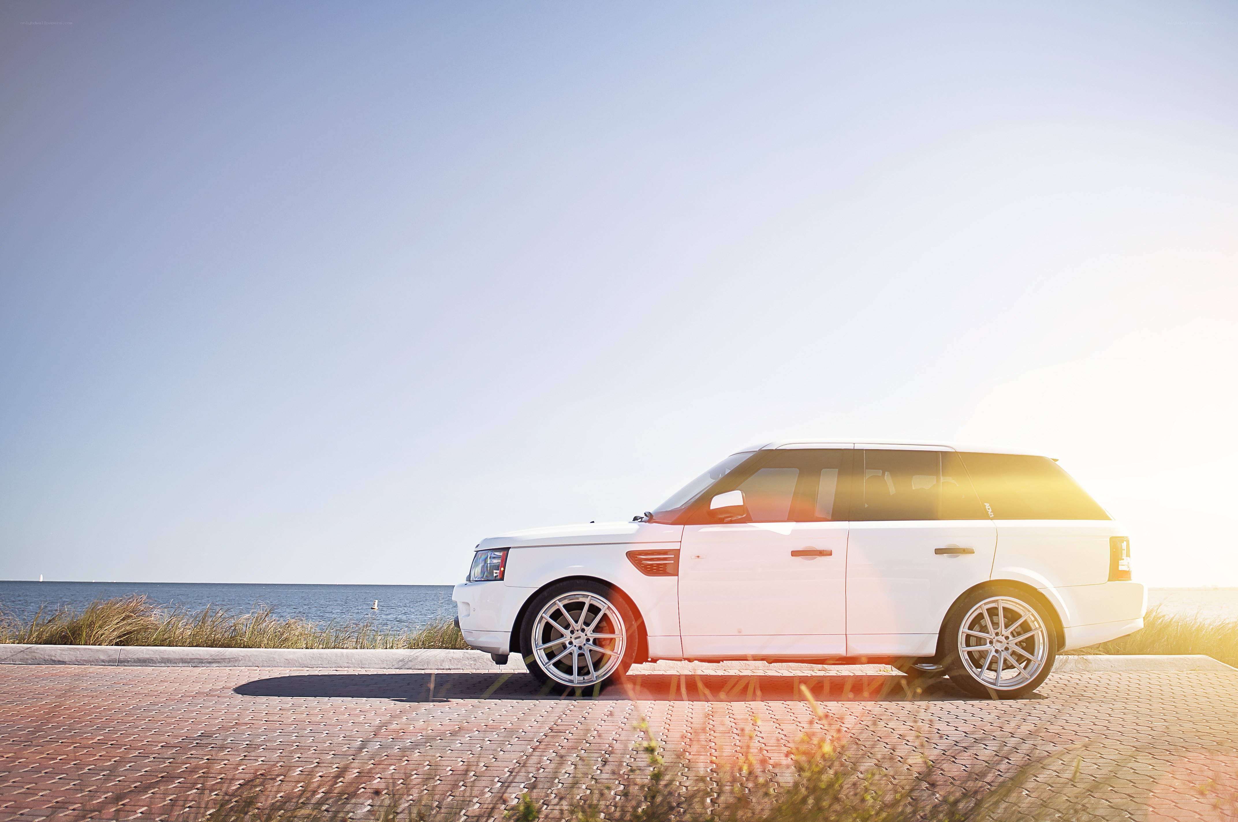 White SUV by the sea