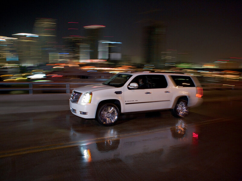 White SUV driving at night