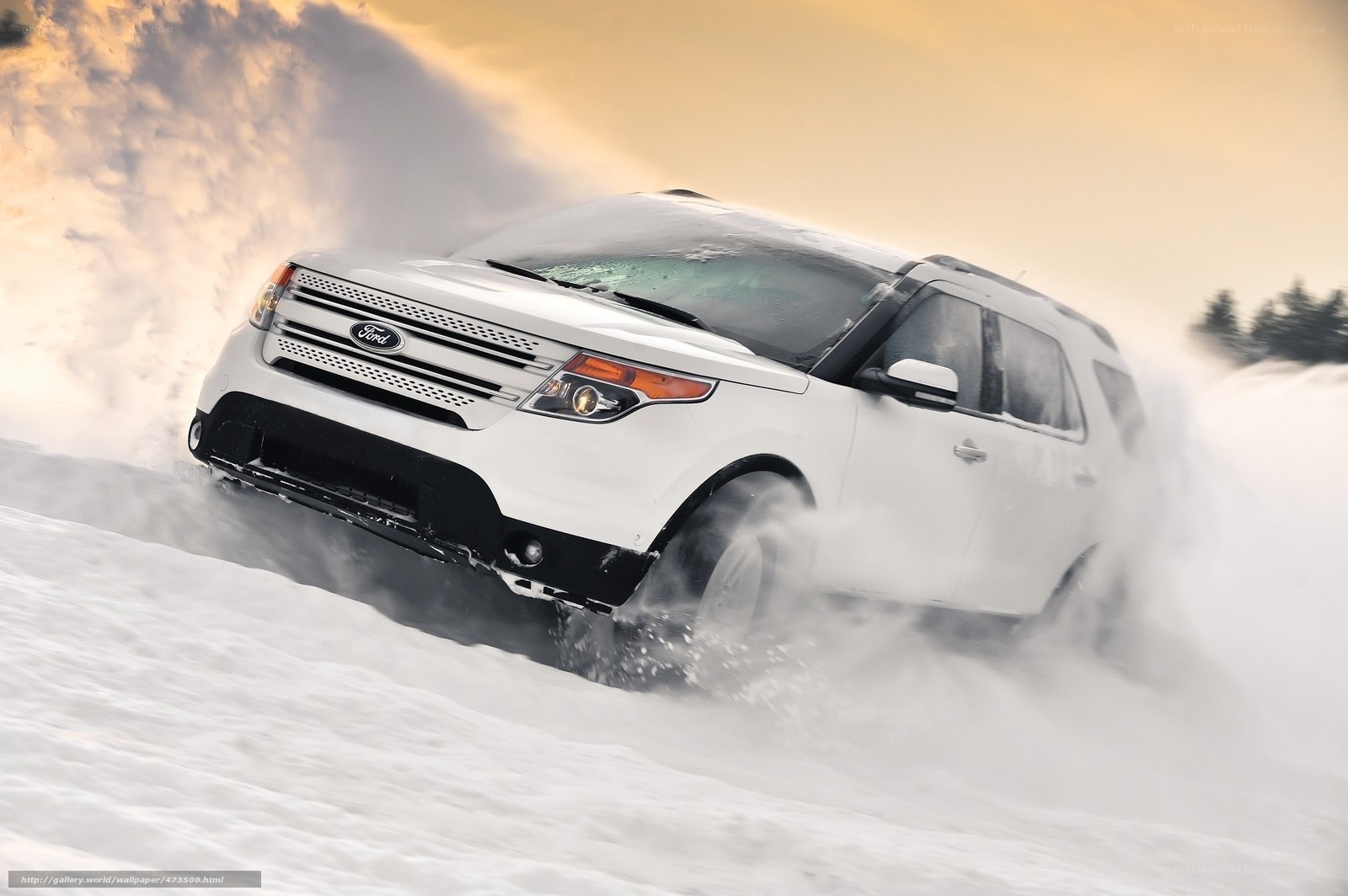 White SUV driving in snow