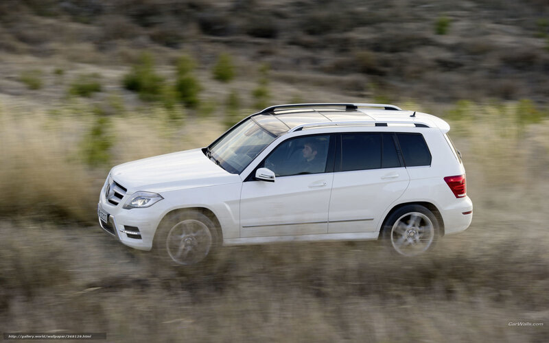 white suv driving on dirt road