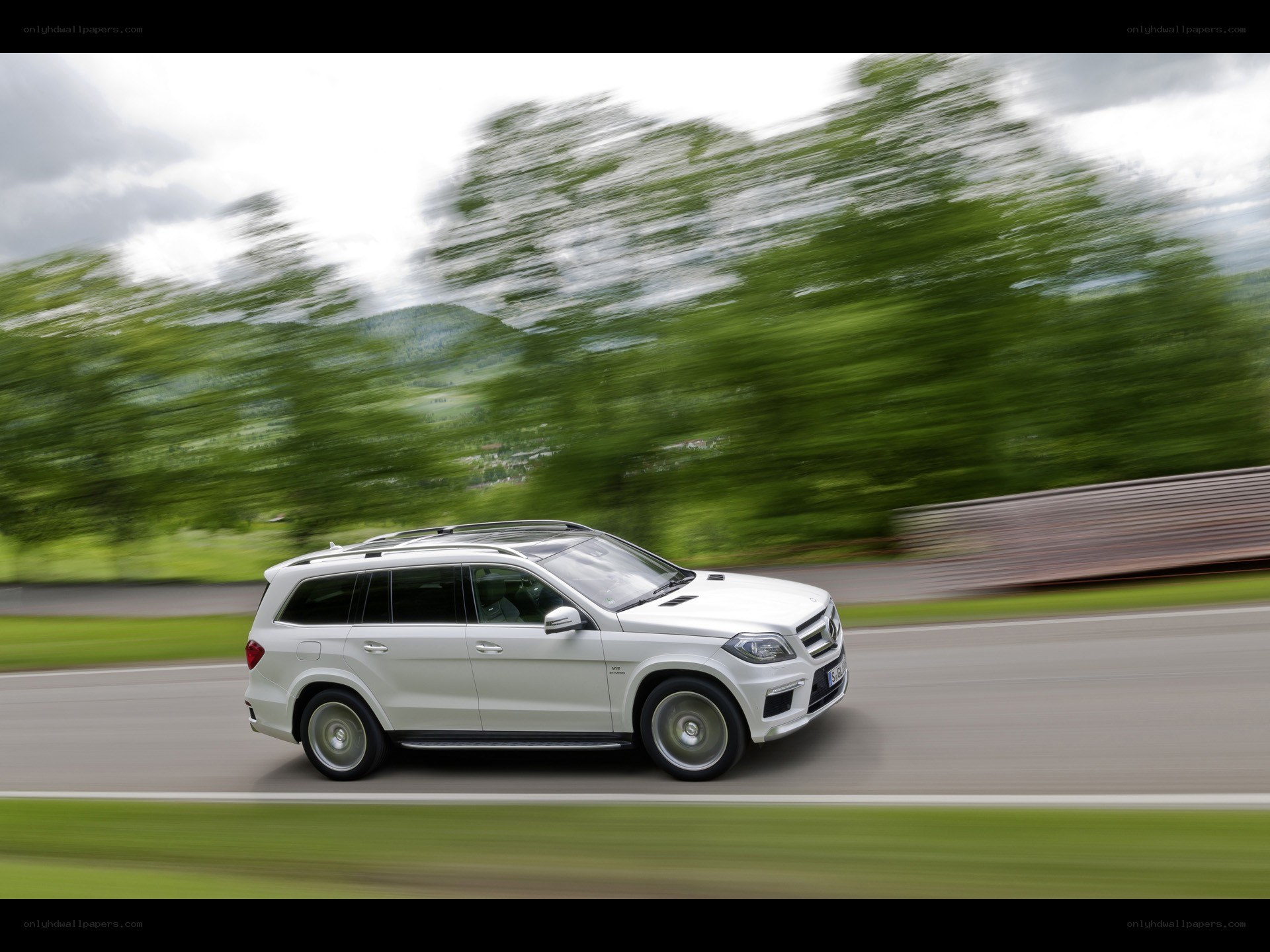 white suv driving on road