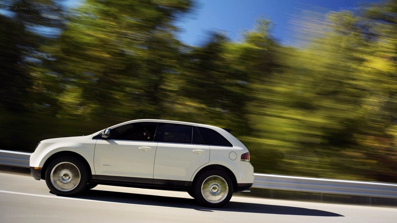 white suv driving on road