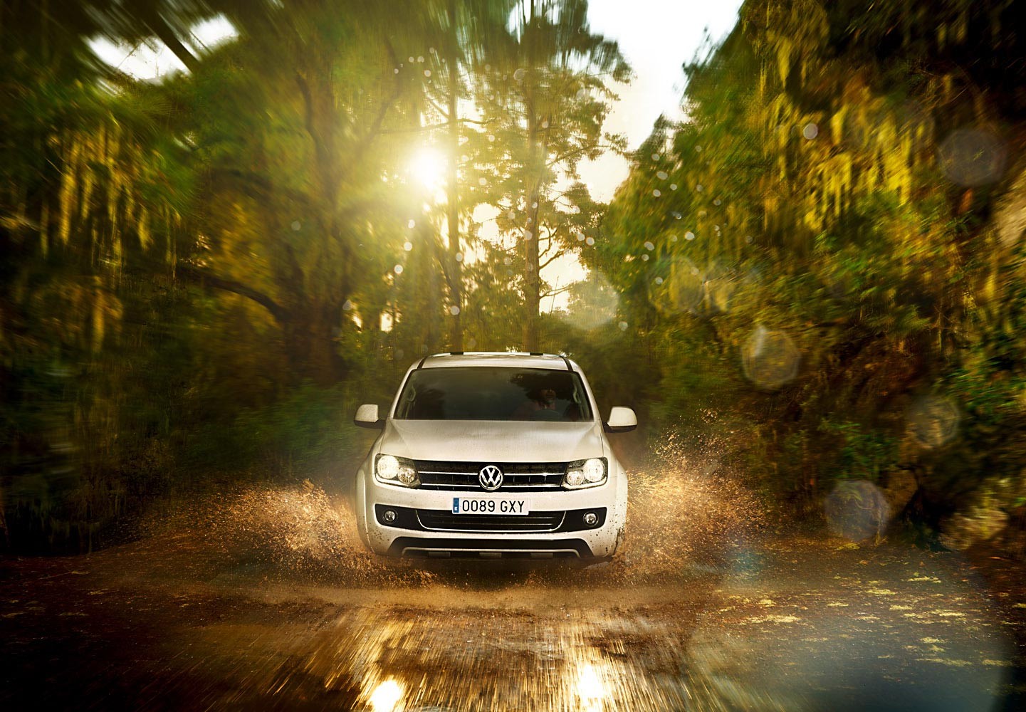 White SUV driving through forest