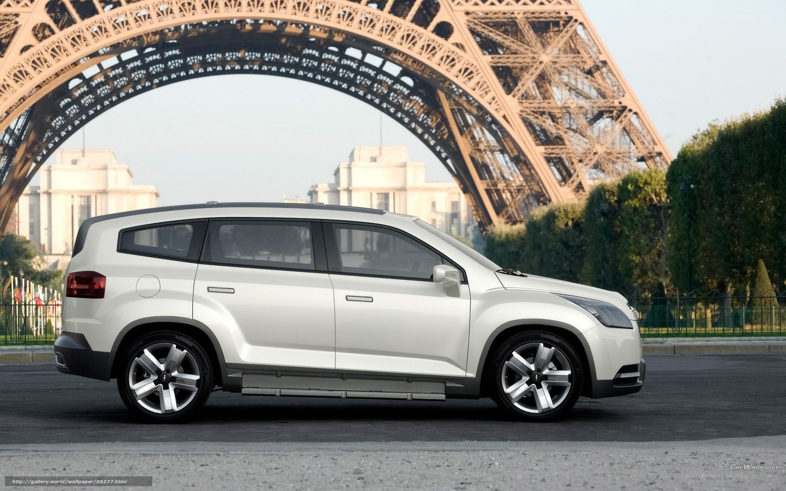 White SUV in front of Eiffel Tower