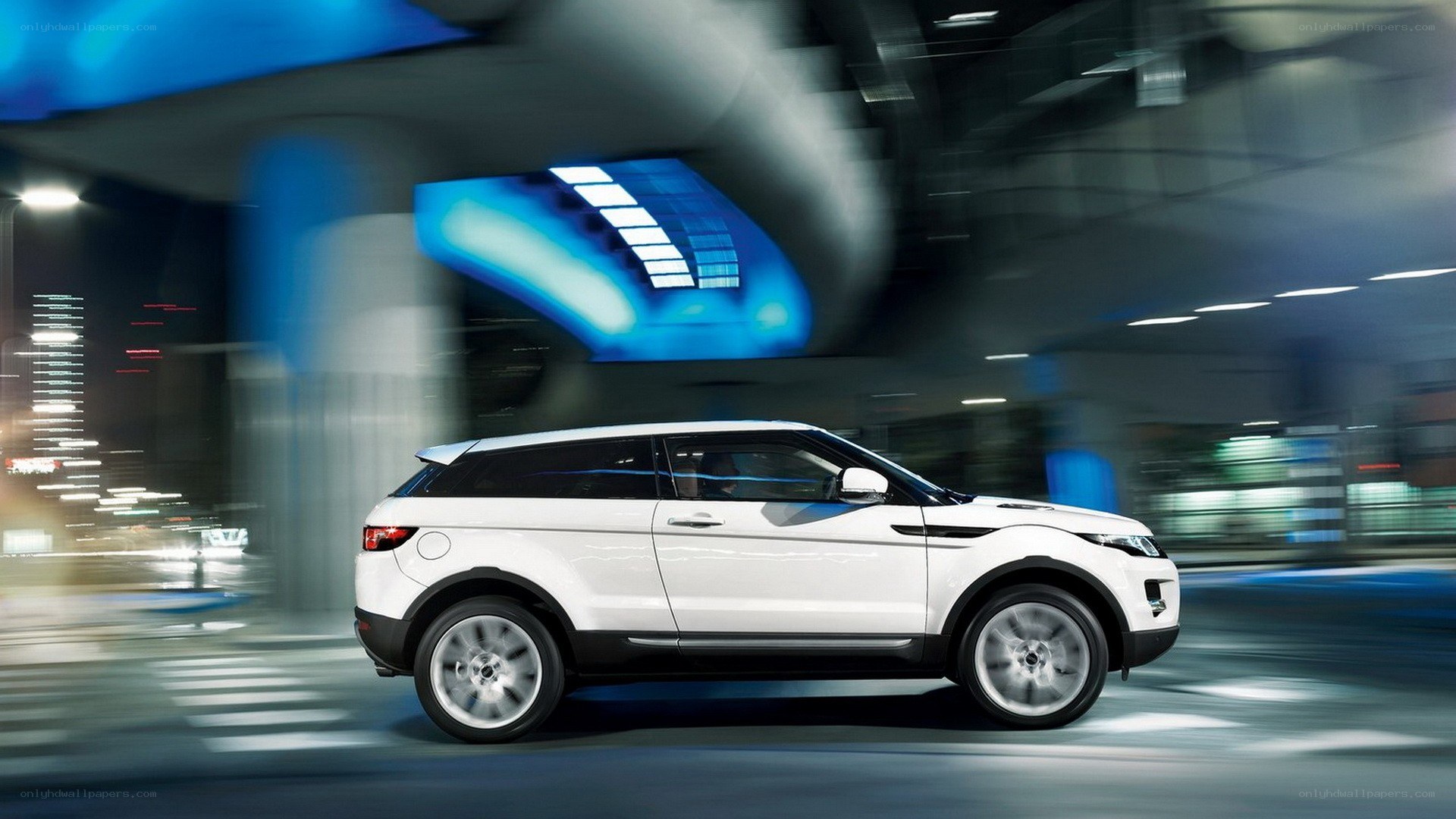 White SUV in motion at night