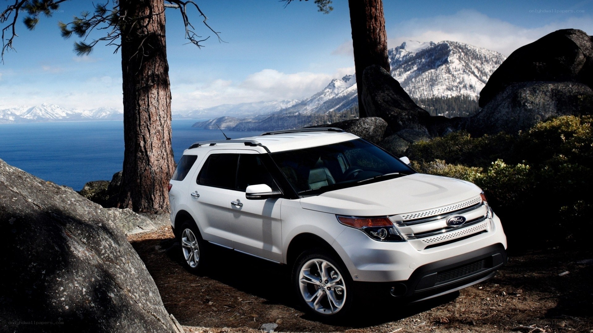 White SUV in mountain landscape