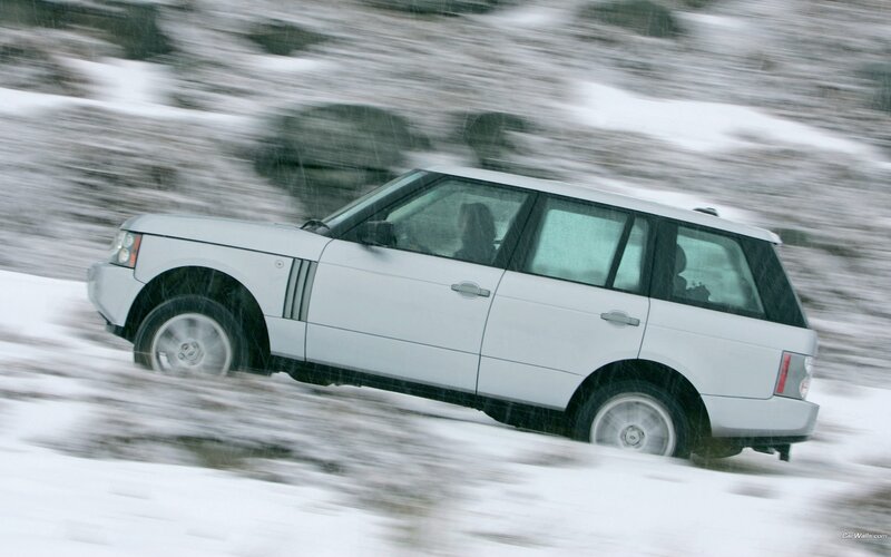 white SUV in snowy landscape