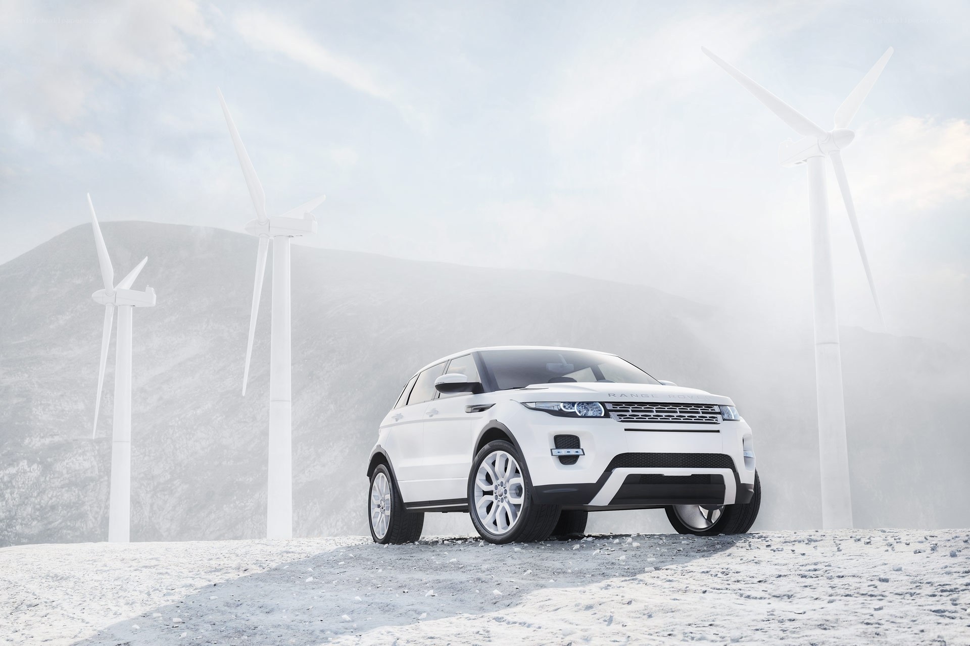 White SUV in wind farm