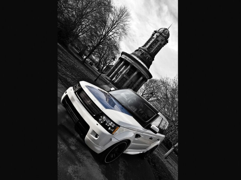 White SUV near a historic tower