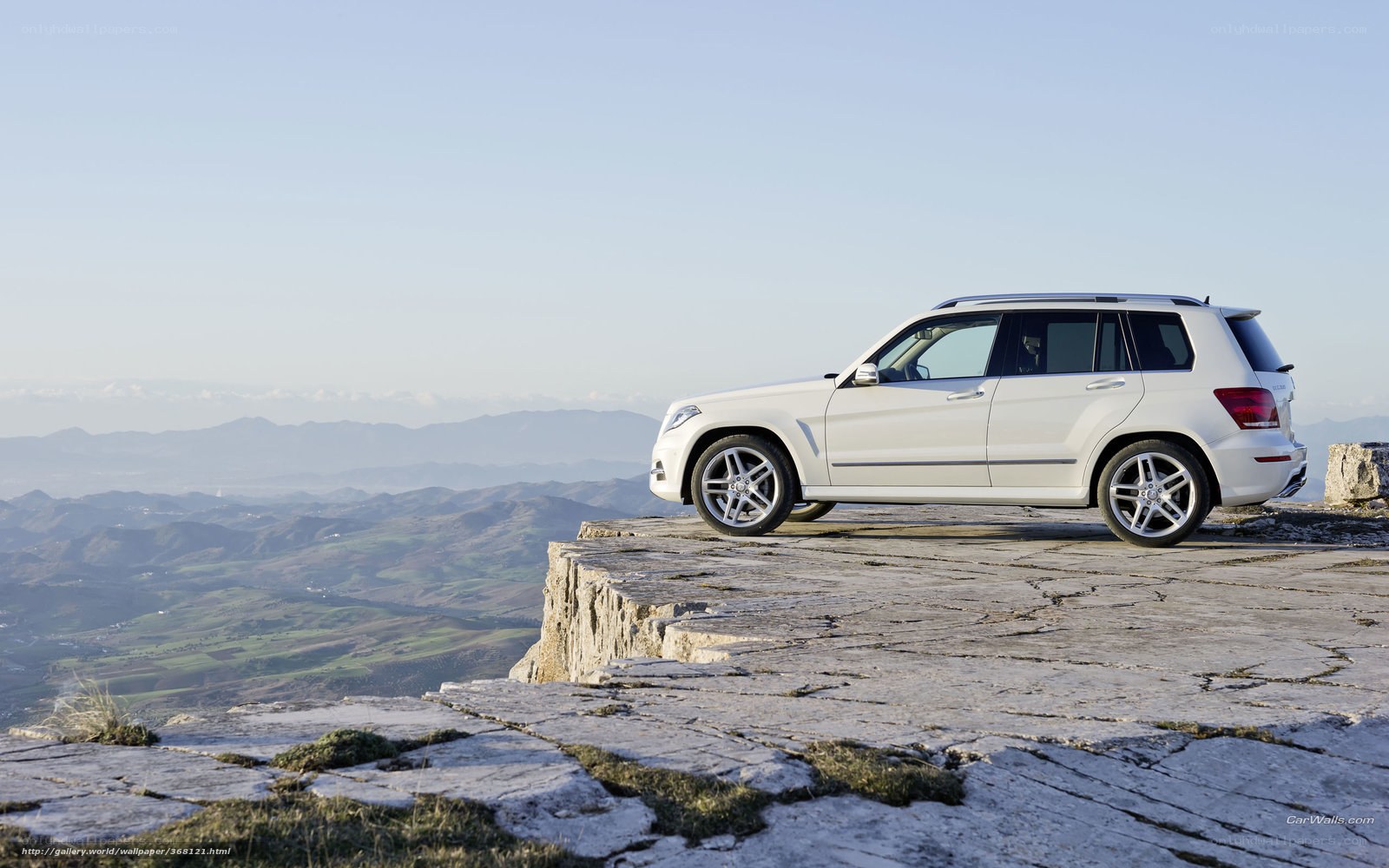 White SUV on a cliff edge