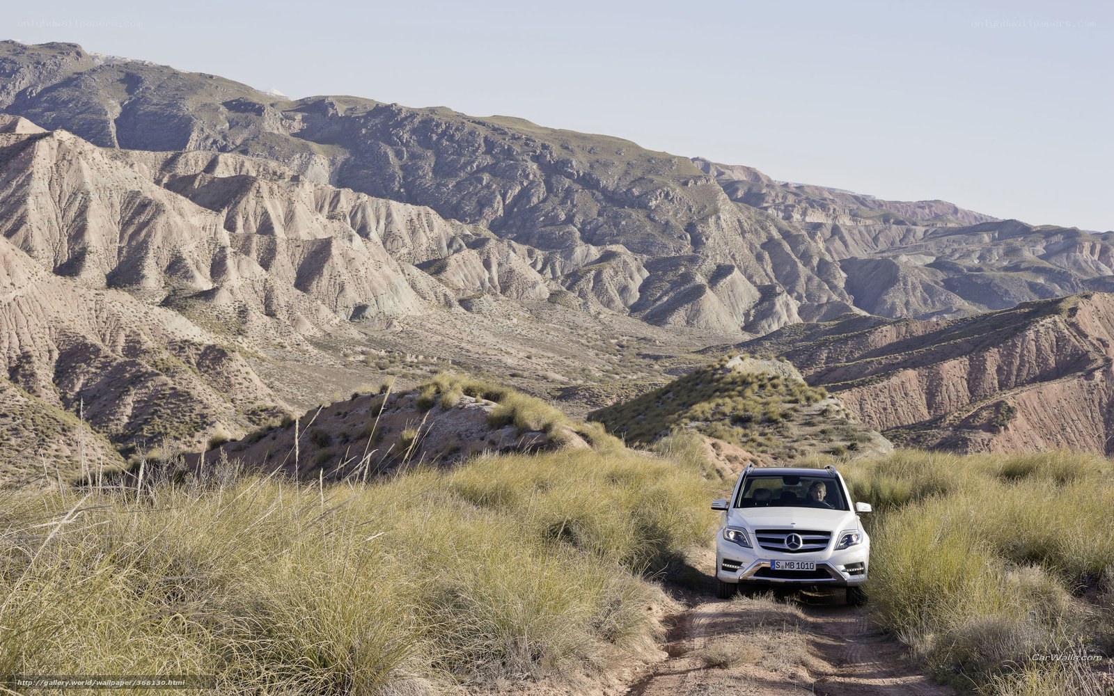White SUV on a dirt road