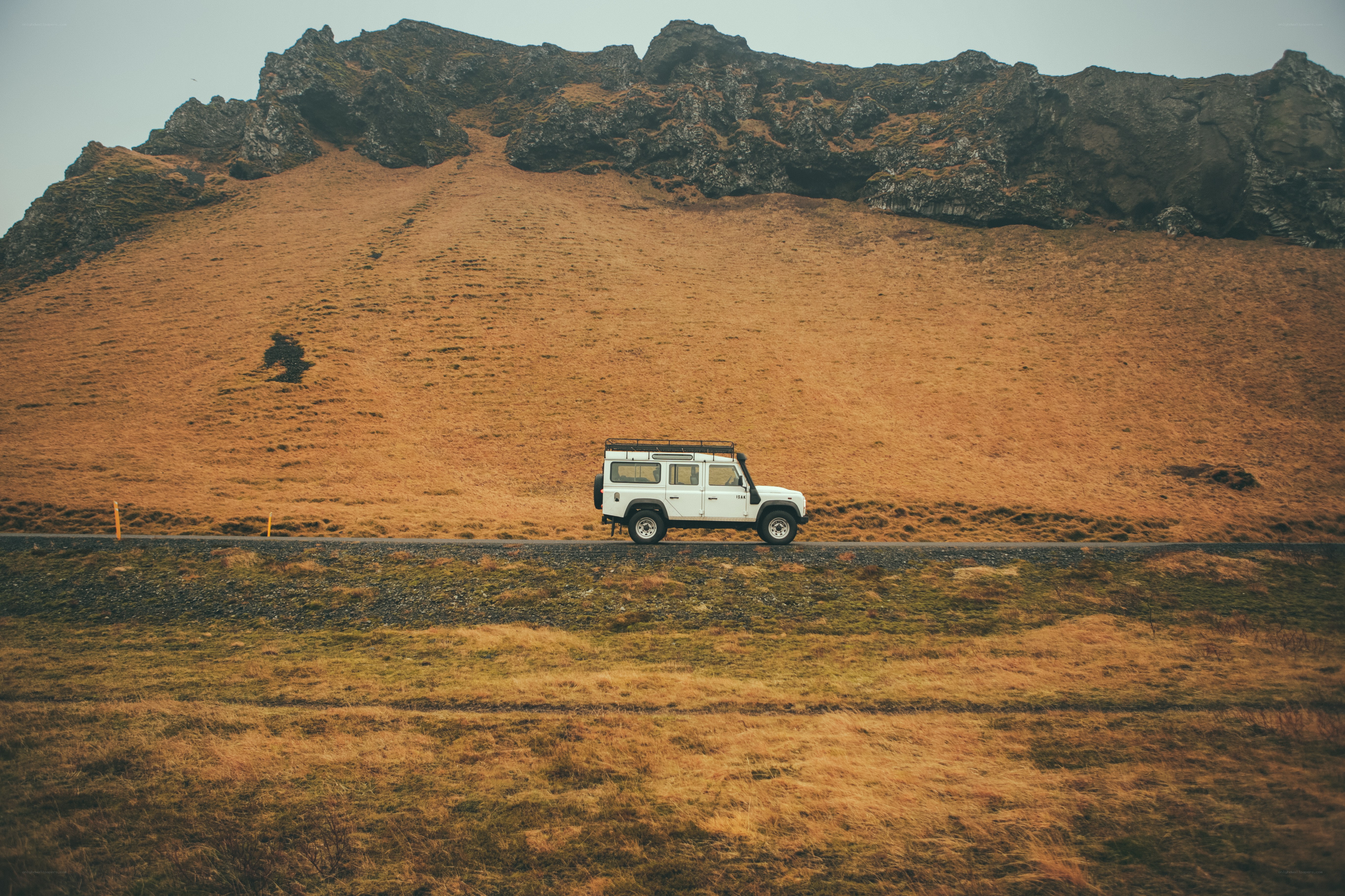 White SUV on a mountain road