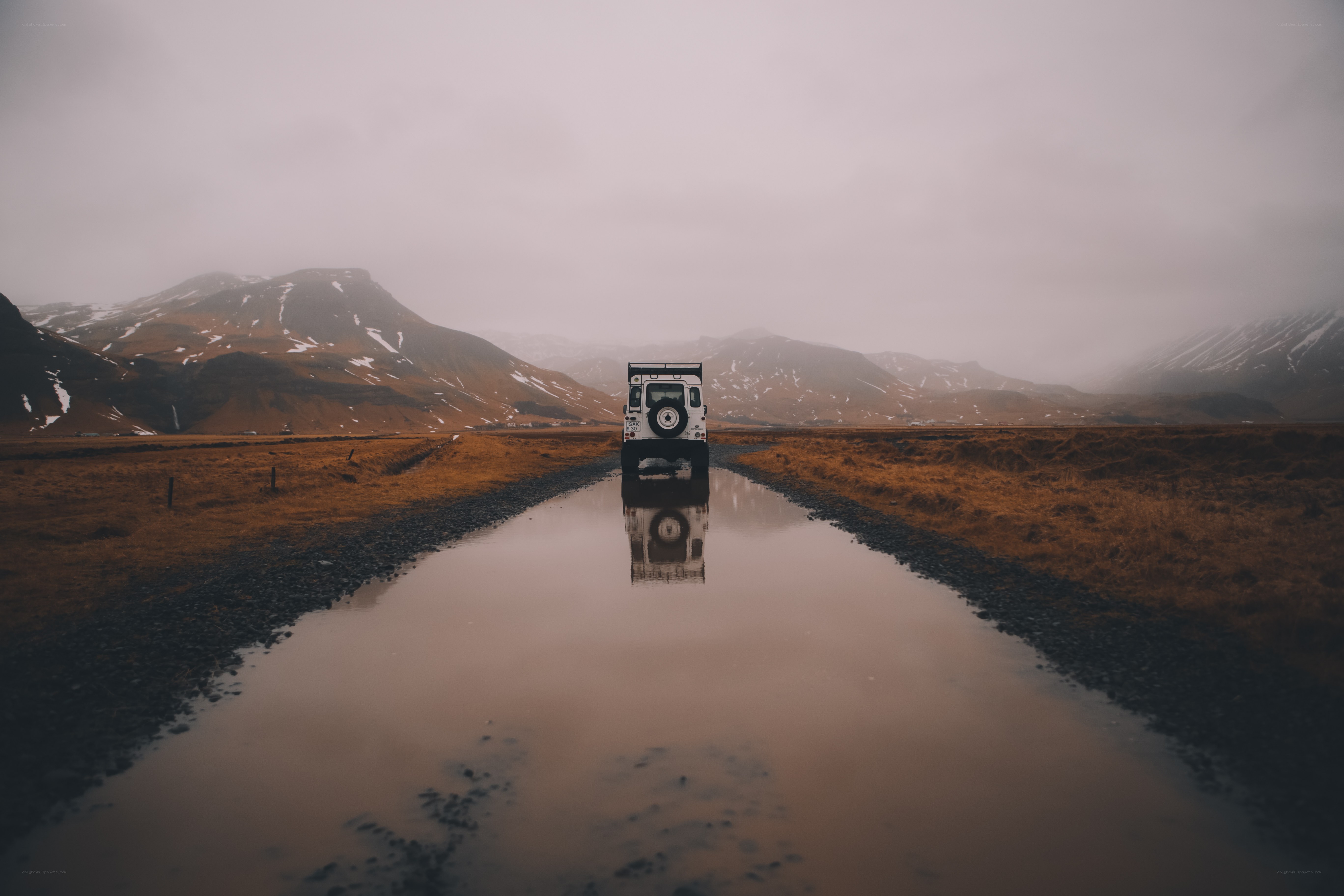 White SUV on a wet road
