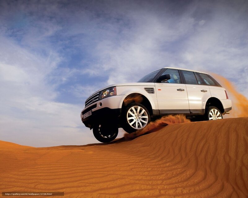 White SUV on desert dune