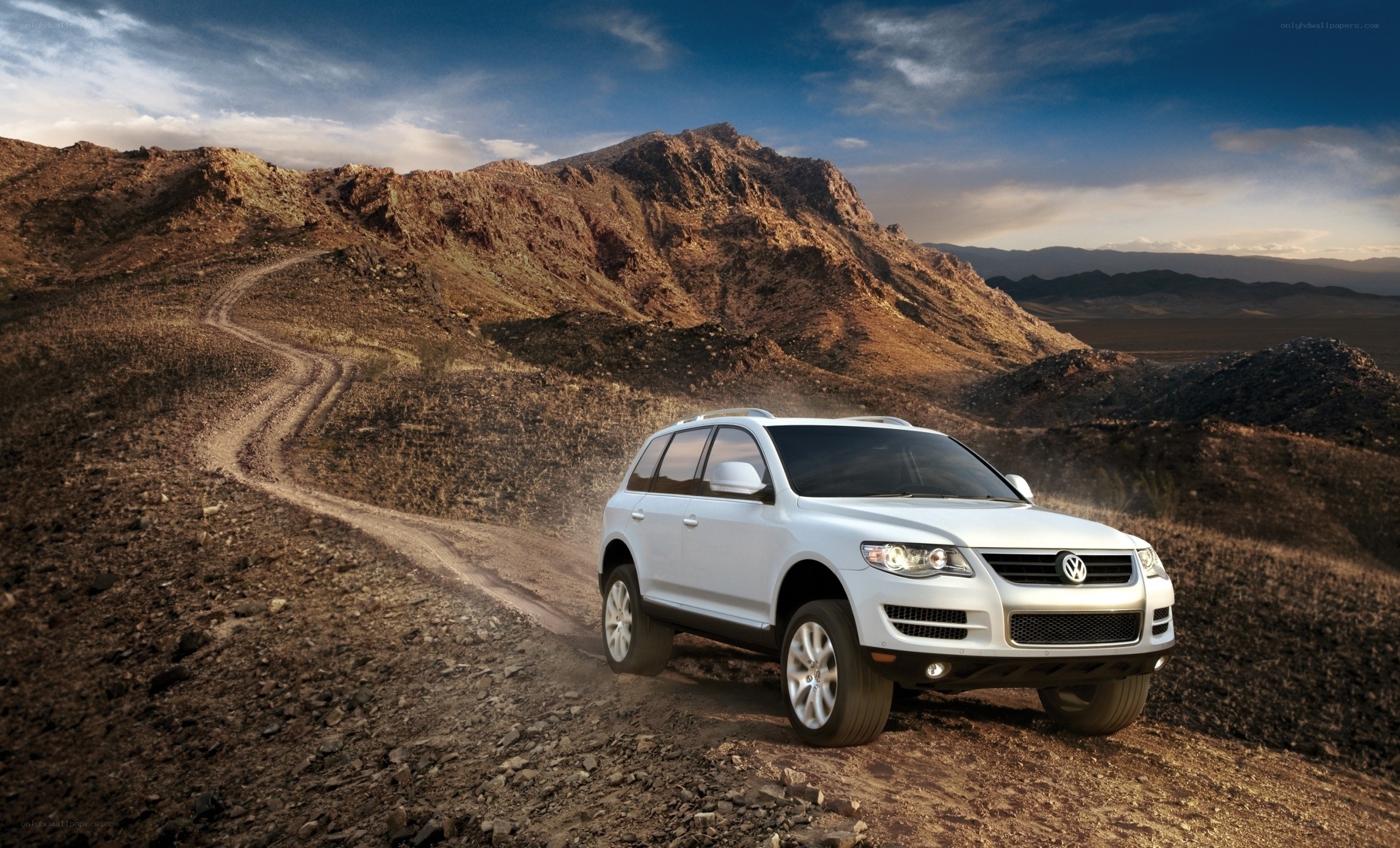 White SUV on desert trail