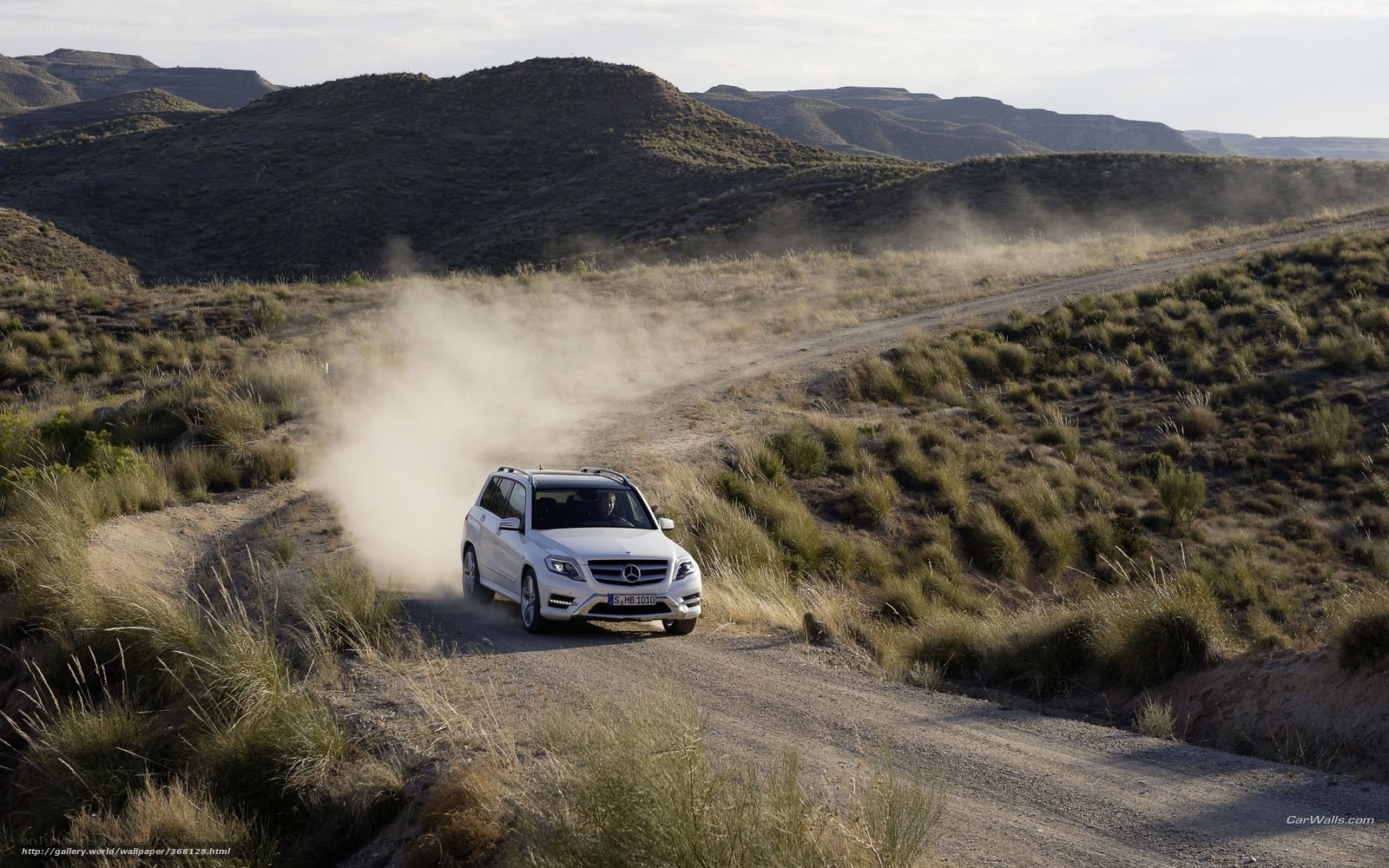 White SUV on dusty trail